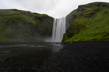 Scenic view of Skogafoss waterfall in Icelandic summer.