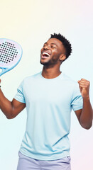 An african american man holding a padel racket, cheering with closed eyes and clenched fist. Happy winner player.
