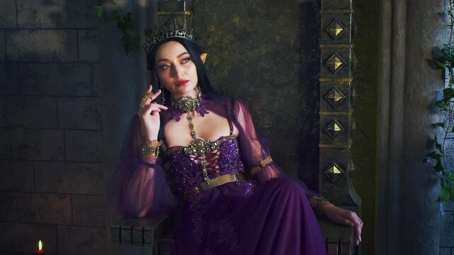 beauty portrait fantasy fairy woman evil elf queen sits on throne, dark gothic room. Sexy face closeup witch girl creative makeup, pointy ears. Gothic vampire princess, golden crown. Old style room