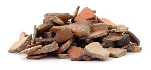 Pile of ancient ceramic shards isolated on white background