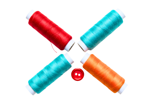 Four colorful spools of thread arranged in a cross shape with a red button in the center isolated on transparent background