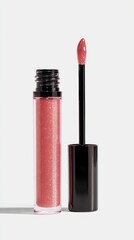 Obraz premium Pink shimmering lip gloss with black applicator on a clean white background