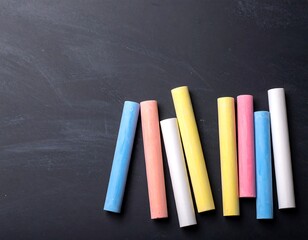 Colorful chalk pieces on a dark board (1)