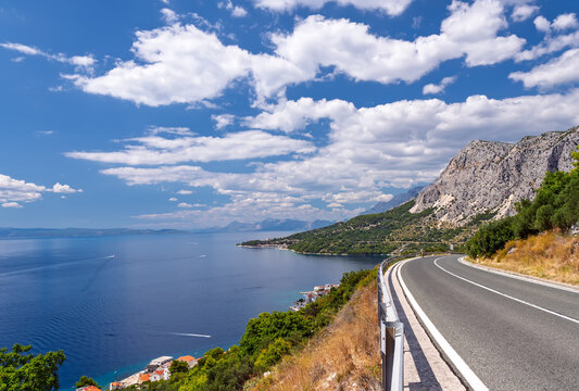 Stunning panoramic view from the coastal road on the Makarska Riviera, Dalmatia, Croatia.The Adriatic highway winding along the dramatic mountain coast, a scenic road trip destination in Croatia - Powered by Adobe