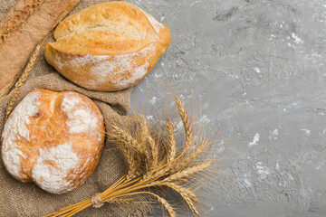 Homemade natural breads. Different kinds of fresh bread as background, top view with copy space
