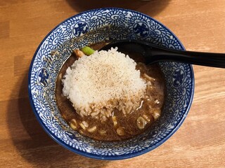 A steaming bowl of ramen with rich broth, tender noodles, sliced pork, boiled egg, nori, and fresh green onions. A comforting and flavorful Japanese classic.