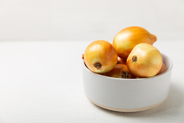 Onion on the kitchen table. onion slice. onion rings. Fresh Yellow Onion. Natural, fresh, vegetarian food. Agricultural products. Healthy eating. Vegetables. Farmer's market. Space for text.Copy space