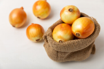 Onion on the kitchen table. onion slice. onion rings. Fresh Yellow Onion. Natural, fresh, vegetarian food. Agricultural products. Healthy eating. Vegetables. Farmer's market. Space for text.Copy space