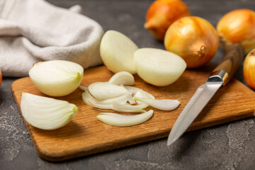 Onion on the kitchen table. onion slice. onion rings. Fresh Yellow Onion. Natural, fresh, vegetarian food. Agricultural products. Healthy eating. Vegetables. Farmer's market. Space for text.Copy space