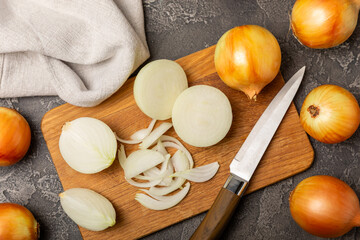 Onion on the kitchen table. onion slice. onion rings. Fresh Yellow Onion. Natural, fresh, vegetarian food. Agricultural products. Healthy eating. Vegetables. Farmer's market. Space for text.Copy space
