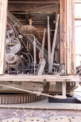 Ancient gear mechanism machine made of iron with many tooth wheels