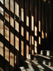 Fototapeta premium Sunlight filters through wooden slats onto stairs.