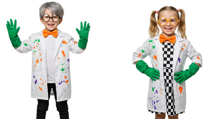 Two children dressed as scientists in lab coats with paint splatters, wearing gloves and glasses, smiling.