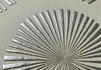 Elegant radiating silver pattern on textured background evoking retro style designs