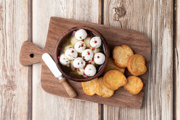 Boursin round creamy goat cheese in oil with red pepper