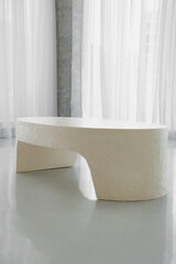 beige table in the big white room