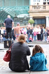 Mother and child watching performance at Covent Garden