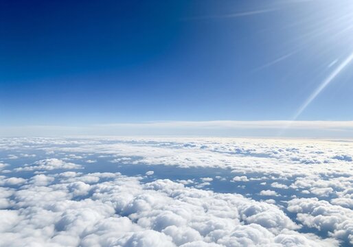 Spectacular view of clouds and blue sky from above with sunlight