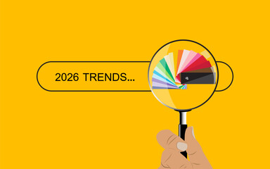 A hand holding magnifying glass over search bar 2026 trends.
