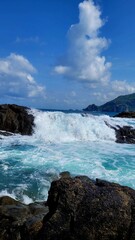 waves crashing on rocks