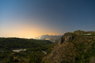 Serene night landscape with mountains and starry sky in Costa Blanca