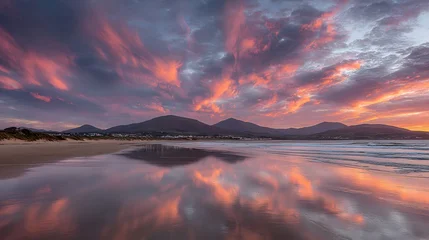 Keuken achterwand Reflectie Colorful sunset reflected on tranquil beach waters.  © irawan