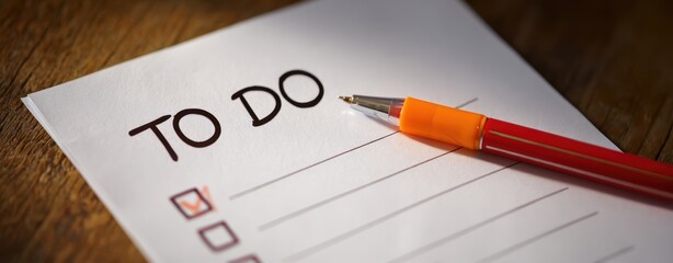 The To-Do List on Paper with Red Pencil in Focus