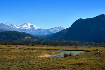 Squamish Estuary Marsh in front of Mamquam Mountain. The Squamish Estuary marsh with snow capped Mamquam Mountain rising in the background.

