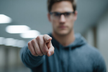 person confidently demonstrates important gesture of pointing emphasizing significant object nearby