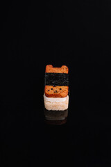 Fun Japanese food concept, kawaii sushi art, and minimal food photography for culinary design. Creative sushi designed in a cute bear shape with seaweed wrap, rice, and topping, placed on a glossy