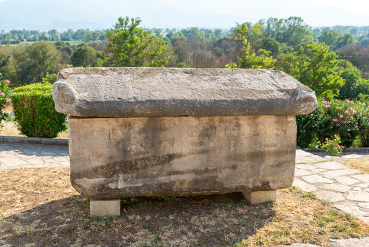 Stone Hellenistic sarcophagus from the era of Philip II, placed on a terrace with panoramic views over the ancient landscape