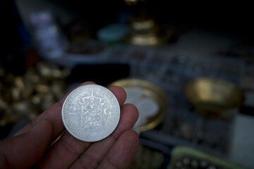A 1943 Netherland 2 1/2 Gulden coin, the Netherlands Indies currency