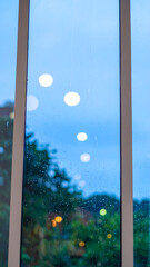 Cityscape through window on cloudy day