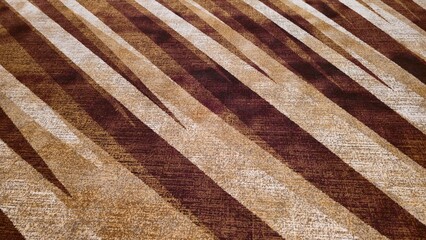 Luxury white and brown striped hotel carpet floor. Colored alternating pattern carpet. Luxury hotel carpet. Graphic pattern carpet texture image.