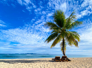 Two chairs on empty beach