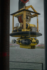 Yellow ROV Suspended Over Water in a Harbor Near Stavanger, Norway