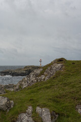 Rocky Coastline with Navigational Beacon on Utsira Island, Norway