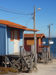 Colorful cabins overlooking tranquil bay in arcachon bay, france