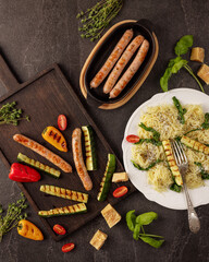 grilled sausages zucchini bell peppers cherry tomato pasta herbs parmesan roasted vegetables rustic...