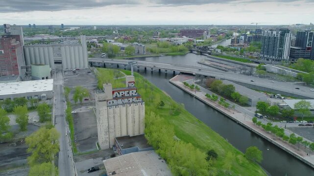 Aerial view of the Lachine Canal in Montreal, Canada. The canal is a popular tourist destination for boating, cycling, and walking. The image shows the canal, bridges, and surrounding buildings.