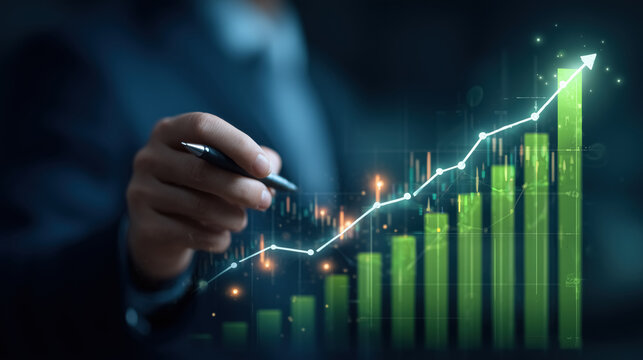 Businessman in suit with stylus or pen pointing at upward-trending line graph, glowing digital chart with green bar graphs. Concept of financial analysis, investment growth, data-driven strategy. 