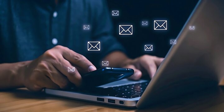 Person Using Smartphone And Laptop With Email Icons Floating In The Air communication technology - Powered by Adobe