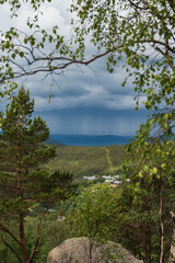 Lush Forest and Settlement Overlooking Water in Norway's Mountains