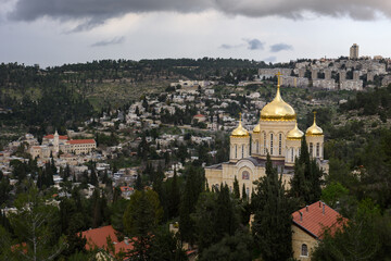 The Russian Gornensky Monastery Church, with its distinctive golden domes and the red-roofed Church of St. John the Baptist in Ein Kerem, Jerusalem, Israel. © Yehoshua Halevi