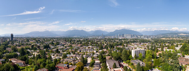 Panoramic View of Burnaby, BC with Skyline, Houses, and Mountain Background
