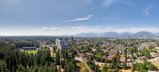 Panoramic Cityscape of Burnaby and Downtown Vancouver Under Clear Blue Sky