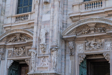 Duomo di Milano church square in Milan city. Gothic Italian architecture. Italy sculpture detail...