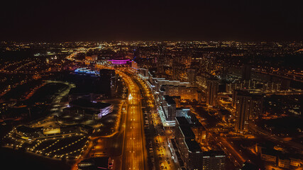 Aerial Nighttime View of Minsk with Illuminated Cityscape