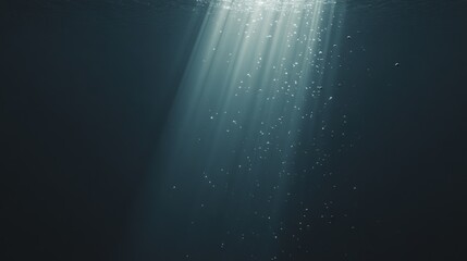 Sunlight streams through ocean waves, creating a mesmerizing play of light and shadow in deep blue waters.