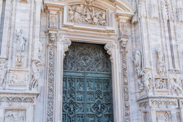 Duomo di Milano door statues detail Gothic Italian architecture. Italy Milan city